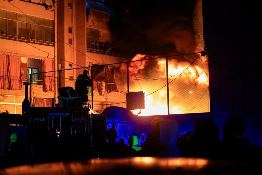 Firefighters work to extinguish a fire at the site of an Israeli strike in Beirut's Mar Elias street, Lebanon November 17, 2024. REUTERS/Thaier Al-Sudani