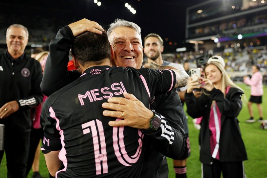 Oct 2, 2024; Columbus, Ohio, USA; Inter Miami CF forward Lionel Messi (10) celebrates with head coach Gerardo Martino after the game against the Columbus Crew at Lower.com Field. Mandatory Credit: Trevor Ruszkowski-Imagn Images