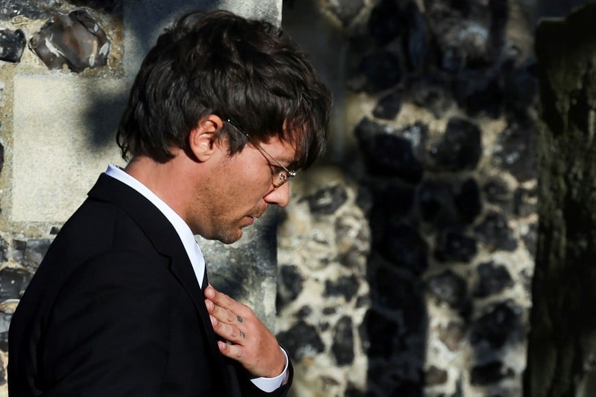 Louis Tomlinson arrives to attend the funeral of former One Direction singer Liam Payne at St. Mary's Church in Amersham, near London, Britain, November 20, 2024. REUTERS/Toby Melville