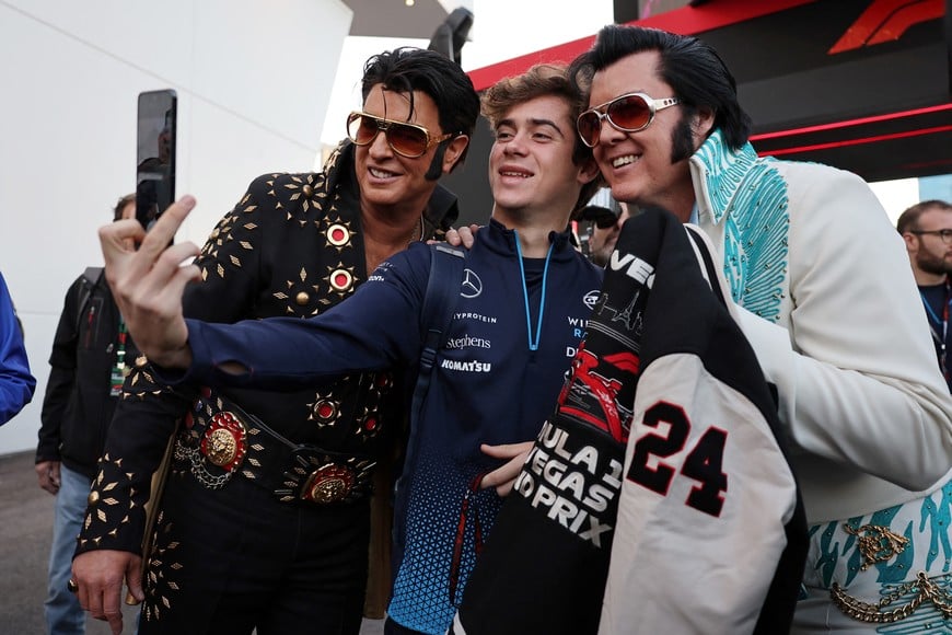 Formula One F1 - Las Vegas Grand Prix - Las Vegas Strip Circuit, Las Vegas, Nevada, United States - November 21, 2024
Williams' Franco Colapinto takes a selfie with performers dressed as Elvis Presley before practice REUTERS/Mike Blake