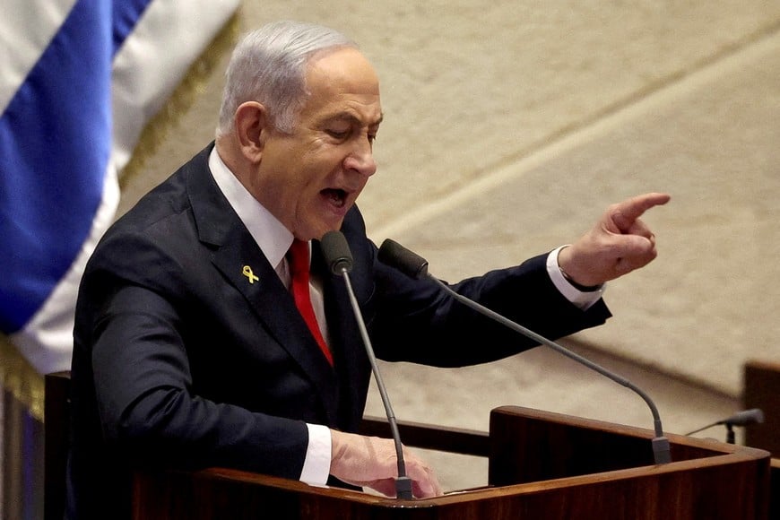 FILE PHOTO: Israeli Prime Minister Benjamin Netanyahu speaks at the plenum, during a discussion on the subject of hostages kidnapped during the deadly October 7, 2023 attack, in Israel's parliament, the Knesset, in Jerusalem, November 18, 2024. REUTERS/Ronen Zvulun//File Photo