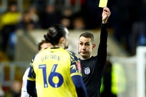 FILE PHOTO: Soccer - Oxford United's Ciaron Brown is shown a yellow card by referee David Coote during the FA Cup third round match v Arsenal - Kassam Stadium, Oxford, Britain - January 9, 2023
 Action Images via Reuters/John Sibley/File Photo