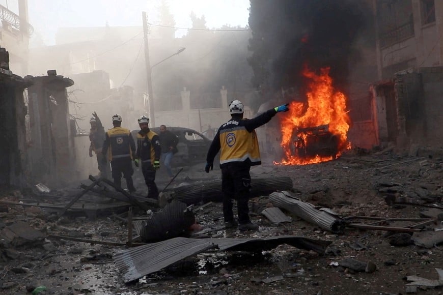 White Helmets members work at the scene of what the organisation says is a strike, in Idlib, Syria, released December 1, 2024, in this still image taken from a handout video. The White Helmets/Handout via REUTERS THIS IMAGE HAS BEEN SUPPLIED BY A THIRD PARTY NO RESALES. NO ARCHIVES. MANDATORY CREDIT.     TPX IMAGES OF THE DAY