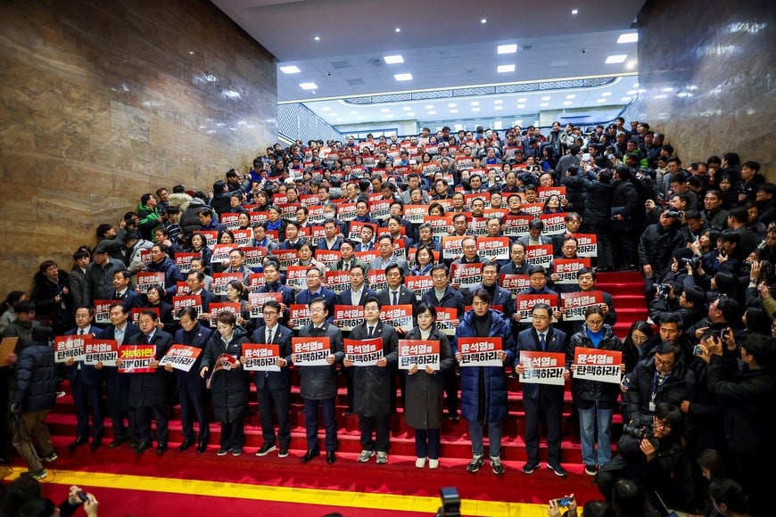 Lawmakers of the main opposition party, the Democratic Party of Korea, attend a press conference after South Korean President Yoon Suk Yeol, who declared martial law which was reversed hours later, survived an impeachment motion, at the National Assembly in Seoul, South Korea, December 7, 2024. REUTERS/Kim Hong-ji