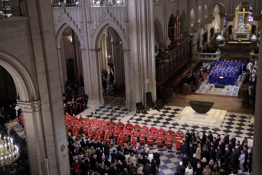 French firefighters attend the reopening ceremony of the Notre Dame de Paris Cathedral, following the 2019 fire, in Paris, France, December 7, 2024. CHRISTOPHE PETIT TESSON/Pool via REUTERS