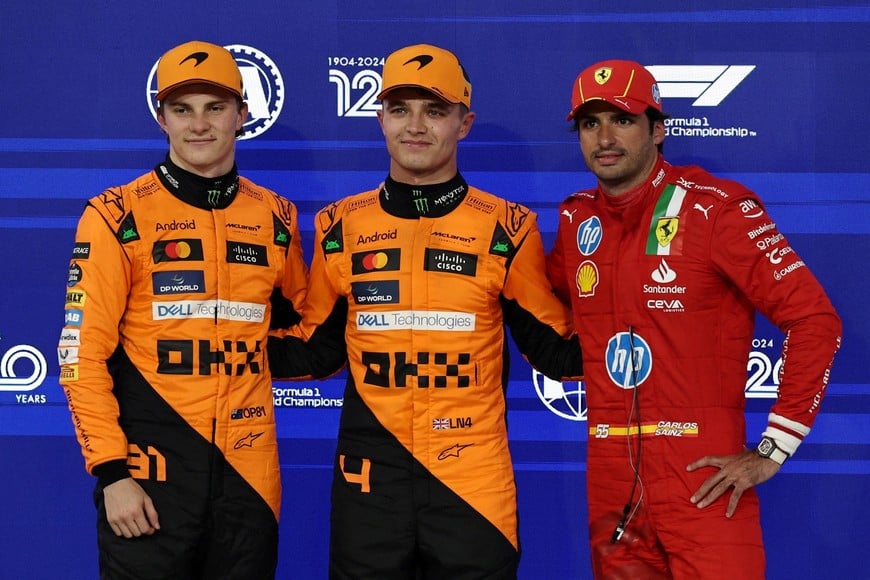 Formula One F1 - Abu Dhabi Grand Prix - Yas Marina Circuit, Abu Dhabi, United Arab Emirates - December 7, 2024
McLaren's Lando Norris celebrates after qualifying in pole position along with second placed McLaren's Oscar Piastri and third placed Ferrari's Carlos Sainz Jr. REUTERS/Hamad I Mohammed/Pool     TPX IMAGES OF THE DAY