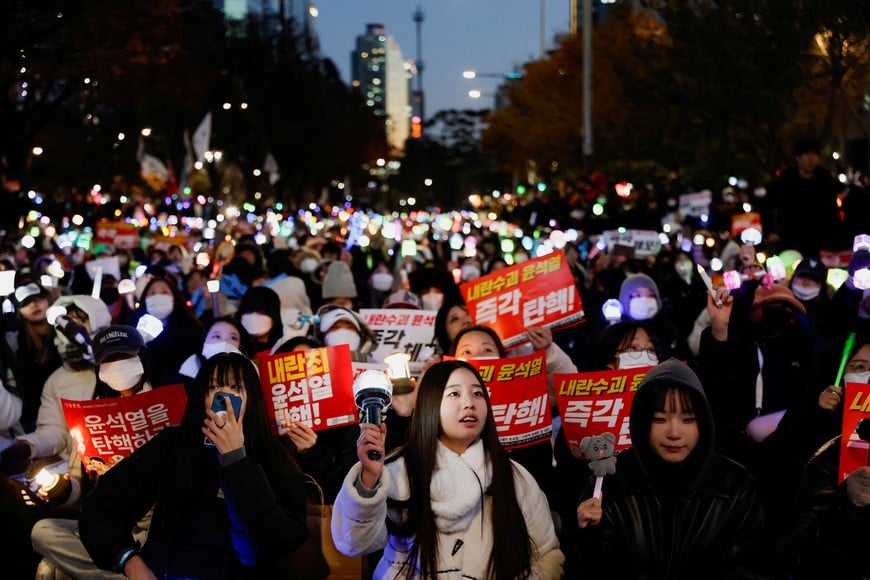 Protesters take part in a rally calling for the impeachment of South Korean President Yoon Suk Yeol, who declared martial law, which was reversed hours later, near the National Assembly in Seoul, South Korea, December 8, 2024. REUTERS/Kim Soo-hyeon