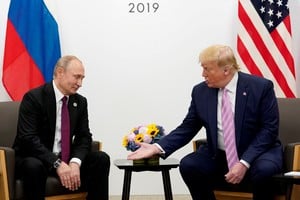 FILE PHOTO: U.S. President Donald Trump gestures during a bilateral meeting with Russia's President Vladimir Putin at the G20 leaders summit in Osaka, Japan, June 28, 2019.  REUTERS/Kevin Lamarque/File Photo