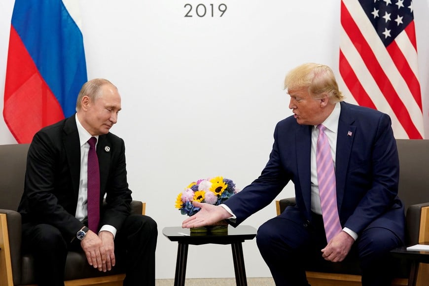 FILE PHOTO: U.S. President Donald Trump gestures during a bilateral meeting with Russia's President Vladimir Putin at the G20 leaders summit in Osaka, Japan, June 28, 2019.  REUTERS/Kevin Lamarque/File Photo