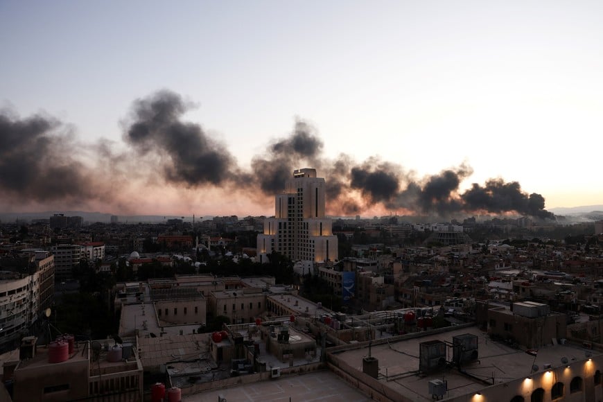 Smoke rises, after Syrian rebels announced that they have ousted Syria's Bashar al-Assad, in Damascus,  Syria, December 8, 2024. REUTERS/Amr Abdallah Dalsh     TPX IMAGES OF THE DAY