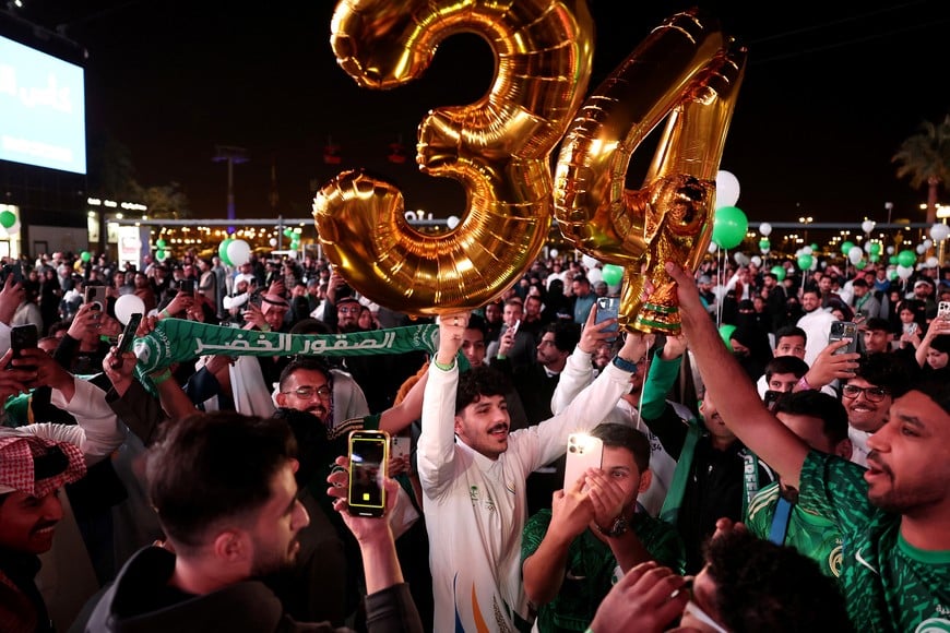 Soccer Football - FIFA confirm Saudi Arabia as 2034 World Cup hosts, Riyadh, Saudi Arabia - December 11, 2024
Fans celebrate as Saudi Arabia is announced as the host nation for the FIFA World Cup 2034
Saudi Arabia Football Association/Handout via REUTERS

ATTENTION EDITORS - THIS IMAGE HAS BEEN SUPPLIED BY A THIRD PARTY.