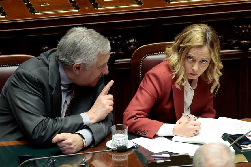 Italy's Prime Minister Giorgia Meloni looks on next to Foreign Minister Antonio Tajani as they attend a session at the lower house of parliament in Rome, Italy, December 17, 2024. REUTERS/Remo Casill