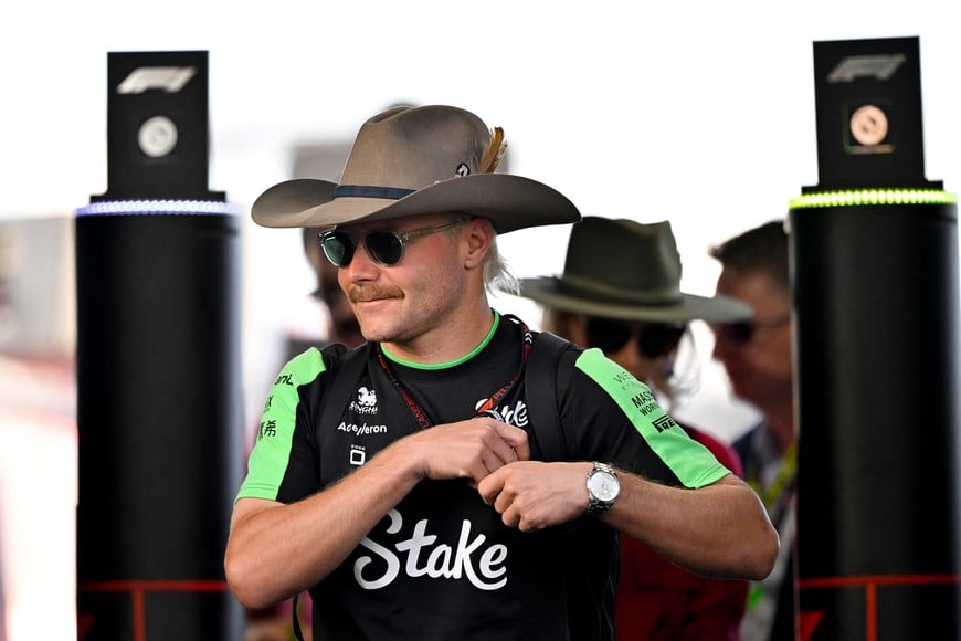 Oct 20, 2024; Austin, Texas, USA; Stake F1 Team Kick Sauber driver Valtteri Bottas (77) of Team Finland walks through the track entrance before the 2024 Formula One US Grand Prix at Circuit of the Americas. Mandatory Credit: Jerome Miron-Imagn Images