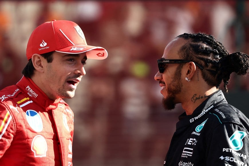 FILE PHOTO: Formula One F1 - Abu Dhabi Grand Prix - Yas Marina Circuit, Abu Dhabi, United Arab Emirates - December 8, 2024
Ferrari's Charles Leclerc with Mercedes' Lewis Hamilton during the drivers parade before the race REUTERS/Jakub Porzycki/File Photo