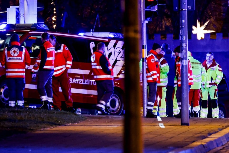 Emergency personnel work at a Christmas market after a car drove into a group of people, according to local media, in Magdeburg, Germany, December 20, 2024. REUTERS/Axel Schmidt