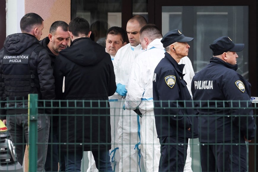 Police officers stand, following a knife attack in a primary school, in Zagreb, Croatia, December 20, 2024. REUTERS/Antonio Bronic