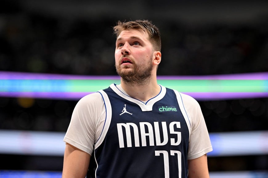 Dec 23, 2024; Dallas, Texas, USA; Dallas Mavericks guard Luka Doncic (77) checks the scoreboard during the second half against the Portland Trail Blazers at the American Airlines Center. Mandatory Credit: Jerome Miron-Imagn Images