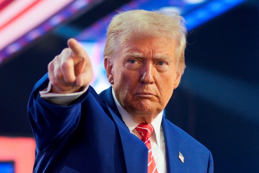 FILE PHOTO: U.S. President-elect Donald Trump gestures at Turning Point USA's AmericaFest in Phoenix, Arizona, U.S., December 22, 2024.  REUTERS/Cheney Orr/File Photo