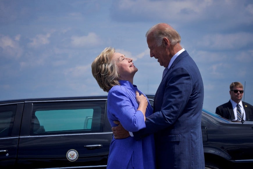 FILE PHOTO: Democratic presidential nominee Hillary Clinton welcomes Vice President Joe Biden as he disembarks from Air Force Two for a joint campaign event in Scranton, Pennsylvania, August 15, 2016. REUTERS/Charles Mostoller/File Photo