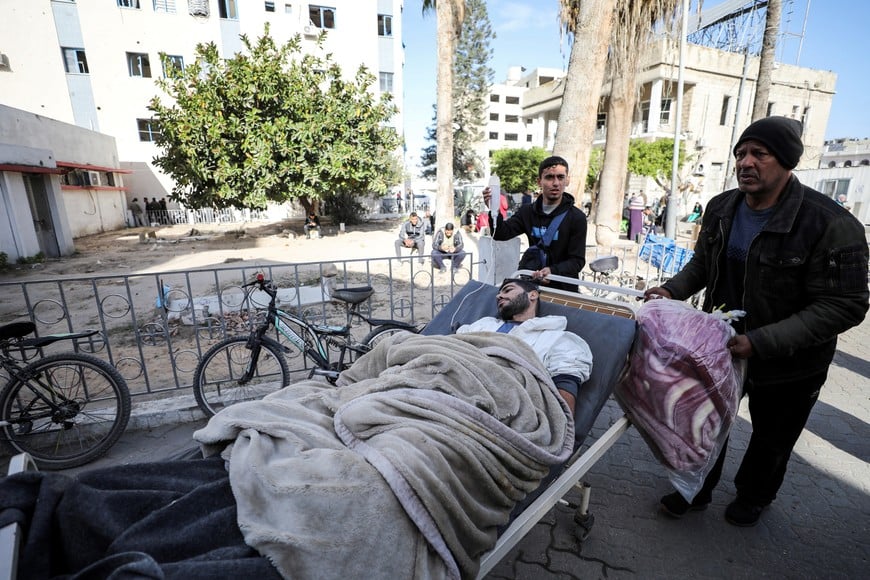 Wounded Palestinians evacuated from Kamal Adwan hospital in northern Gaza, after Israeli forces raided the medical facility, arrive at Al-Ahli al-Arabi hospital, amid the ongoing conflict between Israel and Hamas, in Gaza City, December 28, 2024. REUTERS/Dawoud Abu Alkas