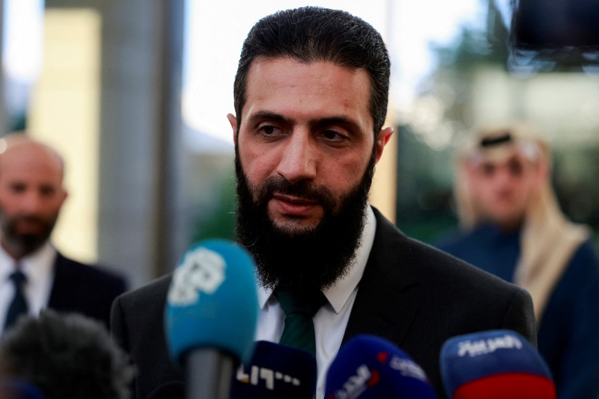 Syria's de facto leader Ahmed al-Sharaa, also known as Abu Mohammed al-Golani, speaks to the media during a meeting with Qatar's Minister of State Mohammed bin Abdulaziz Al-Khulaifi, after the ousting of Syria's Bashar al-Assad, in Damascus, Syria, December 23, 2024. REUTERS/Ammar Awad