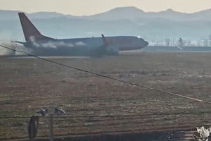 Black smoke emits from Jeju Air flight 7C2216 as it veers off the runway following a crash after landing at Muan International Airport in Muan, South Korea December 29, 2024 in this screengrab obtained from video. Lee Geun-young/via REUTERS  THIS IMAGE HAS BEEN SUPPLIED BY A THIRD PARTY. MANDATORY CREDIT. NO RESALES. NO ARCHIVES.     TPX IMAGES OF THE DAY