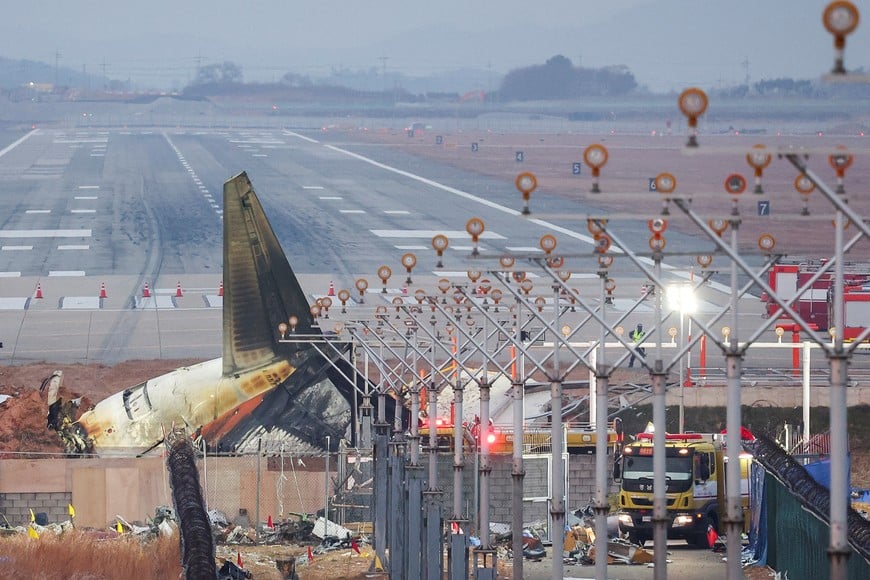 The wreckage of the Jeju Air aircraft that went off the runway and crashed lies at Muan International Airport, in Muan, South Korea, December 30, 2024. REUTERS/Kim Hong-Ji