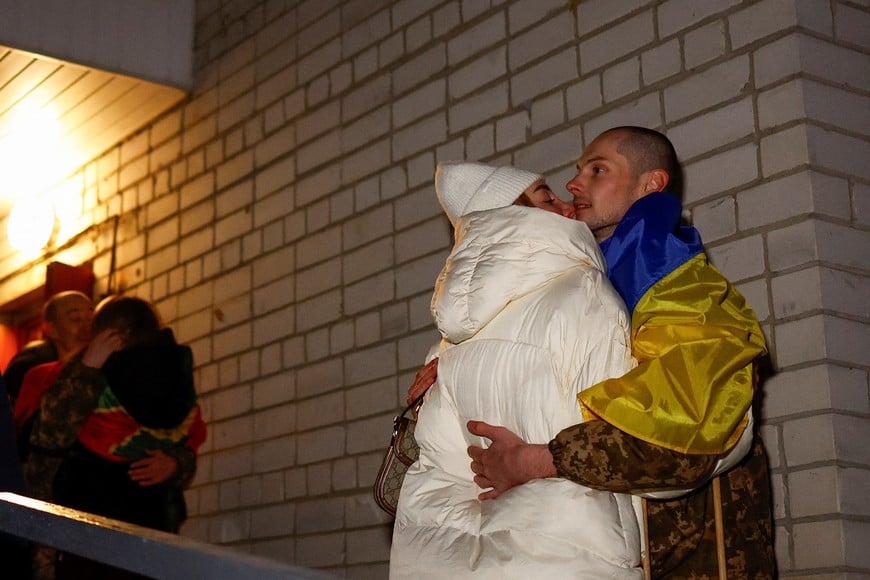 Kateryna embraces her husband Yevhen, a Ukrainian prisoner of war (POW), as he returns after a swap, amid Russia's attack on Ukraine, in an undisclosed location in Ukraine, December 30, 2024. REUTERS/Valentyn Ogirenko