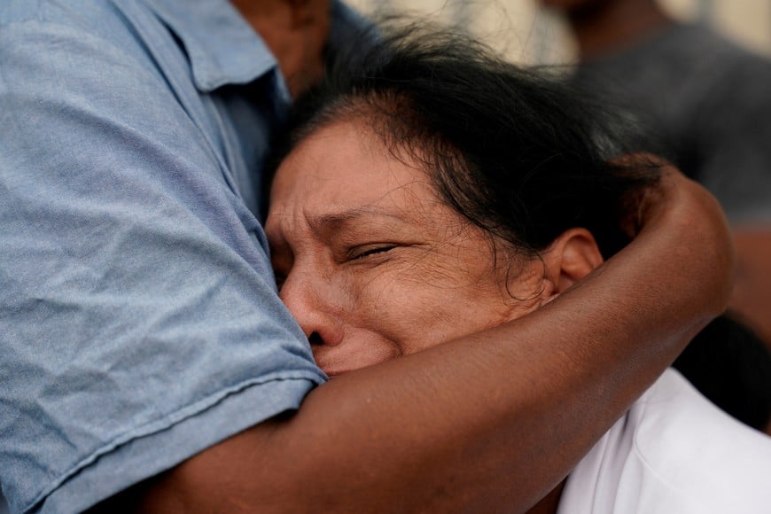 A relative reacts after Ecuador attorney general's office says four bodies found last week confirmed as missing boys of four minors, as it will seek charges against 16 military personnel over their suspected involvement, in Guayaquil, Ecuador December 31, 2024. REUTERS/Santiago Arcos