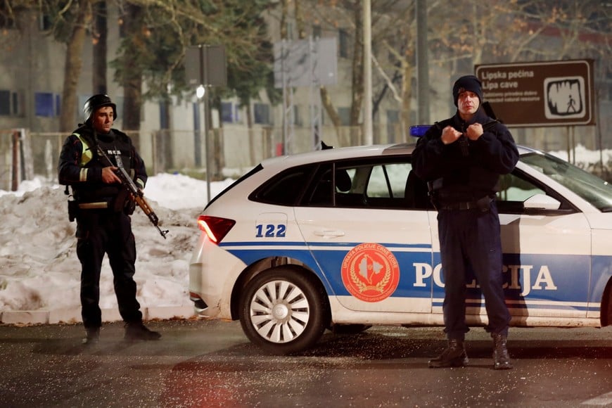 Police stand on a checkpoint near where a gunman opened fire at a restaurant and killed several people in Cetinje, Montenegro, January 1, 2025. REUTERS/Stevo Vasiljevic