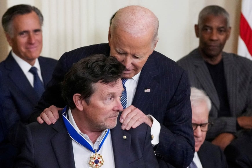 U.S. President Joe Biden presents the Presidential Medal of Freedom to Michael J. Fox, during a ceremony in the East Room of the White House, in Washington, U.S. January 4, 2025. REUTERS/Ken Cedeno     TPX IMAGES OF THE DAY