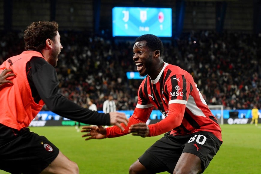 Soccer Football - Italian Super Cup - Semi Final - Juventus v AC Milan - Al Awwal Park, Riyadh, Saudi Arabia - January 3, 2025
AC Milan's Yunus Musah celebrates their second goal, an own goal scored by Juventus' Weston McKennie REUTERS/Jennifer Lorenzini