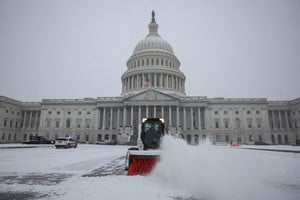 A snowplow clears snow in front of the U.S. Capitol, as a winter storm that brought snow, ice and freezing temperatures to a broad swath of the U.S. arrived in Washington, U.S. January 6, 2025. REUTERS/Marko Djurica