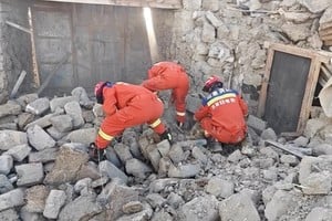 Rescue teams look through rubble in the aftermath of an earthquake in a location given as Shigatse City, Tibet Autonomous Region, China, January 7, 2025, in this screengrab obtained from a handout video. Tibet Fire and Rescue/Handout via REUTERS    THIS IMAGE HAS BEEN SUPPLIED BY A THIRD PARTY. NO RESALES. NO ARCHIVES. MANDATORY CREDIT