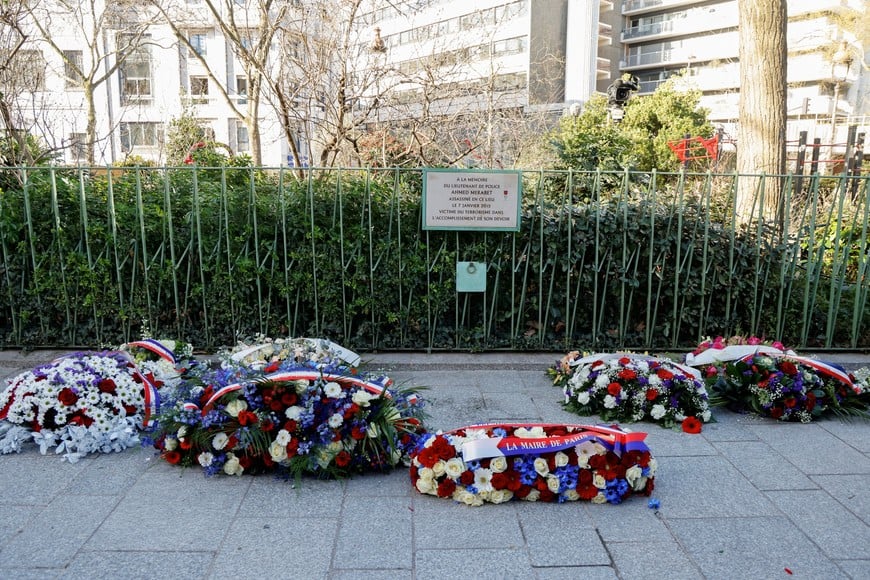 Wreaths are laid in front of a plaque paying tribute to police officer Ahmed Merabet, shot and killed by the perpetrators of the 2015 Charlie Hebdo attack, during commemorations marking 10 years since an Islamist attack on the Charlie Hebdo satirical newspaper and the Hypercacher jewish supermarket in Paris, France on January 7, 2025. LUDOVIC MARIN/Pool via REUTERS