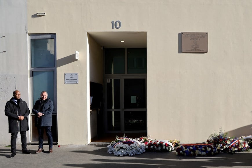 Wreaths are laid in front of the former offices of Charlie Hebdo, site of the 2015 attack, during commemorations marking 10 years since an Islamist attack on the Charlie Hebdo satirical newspaper and the Hypercacher jewish supermarket in Paris, France on January 7, 2025. LUDOVIC MARIN/Pool via REUTERS