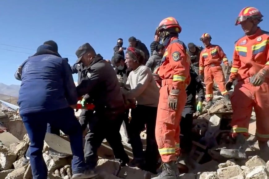 Rescue teams tend to casualties in the aftermath of an earthquake in a location given as Shigatse City, Tibet Autonomous Region, China, January 7, 2025, in this screengrab obtained from a handout video. Tibet Fire and Rescue/Handout via REUTERS    THIS IMAGE HAS BEEN SUPPLIED BY A THIRD PARTY. NO RESALES. NO ARCHIVES. MANDATORY CREDIT