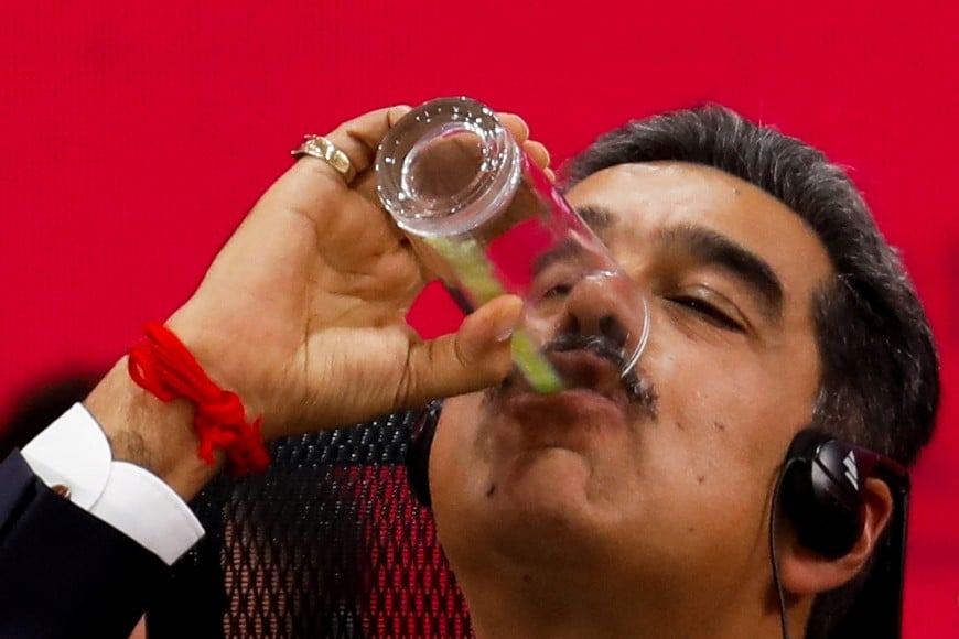 Venezuela's President Nicolas Maduro drinks a juice during a meeting of leaders of the member states of the Bolivarian Alliance for the Peoples of Our America and the Treaty of Commerce and Promotion (ALBA-TCP), in Caracas, Venezuela December 14, 2024. REUTERS/Leonardo Fernandez Viloria