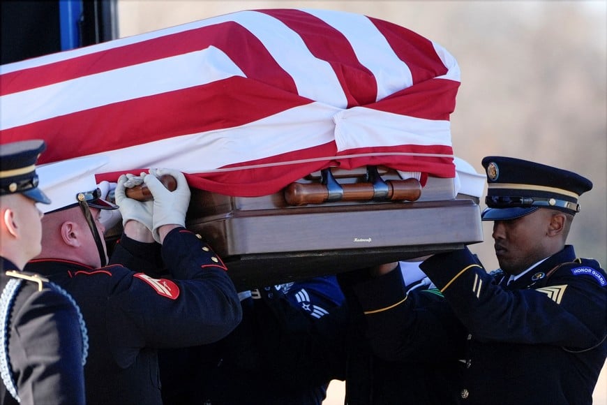 Members of the joint services body geared team move the casket of former U.S. President Jimmy Carter at Lawson Army Airfield, in Fort Moore, Georgia, U.S., January 9, 2025.  Alex Brandon/Pool via REUTERS