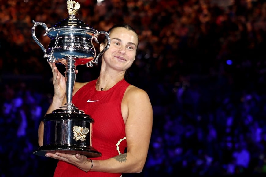 Tennis - Australian Open - Melbourne Park, Melbourne, Australia - January 27, 2024
Belarus' Aryna Sabalenka poses for a picture with the trophy after winning the final against China's Qinwen Zheng REUTERS/Eloisa Lopez