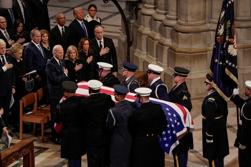 U.S. President  Joe Biden, former U.S. President Bill Clinton, former U.S. President  Barack Obama, U.S President-elect Donald Trump, U.S. Vice President  Kamala Harris, and former U.S. President George W. Bush react as the casket of former U.S. President Jimmy Carter is carried away, on the day of his State Funeral, at the Washington National Cathedral in Washington, U.S., January 9, 2025. REUTERS/Elizabeth Frantz