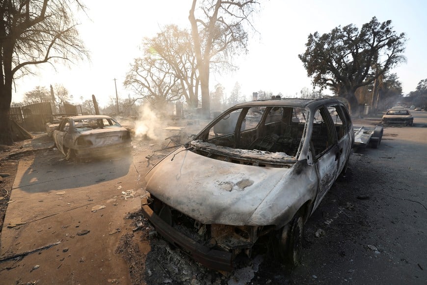 Vehicles destroyed by the Eaton Fire stand, while a pair of massive wildfires menacing Los Angeles from the east and west were still burning uncontained, in Altadena, California, U.S. January 9, 2025. REUTERS/Mario Anzuoni