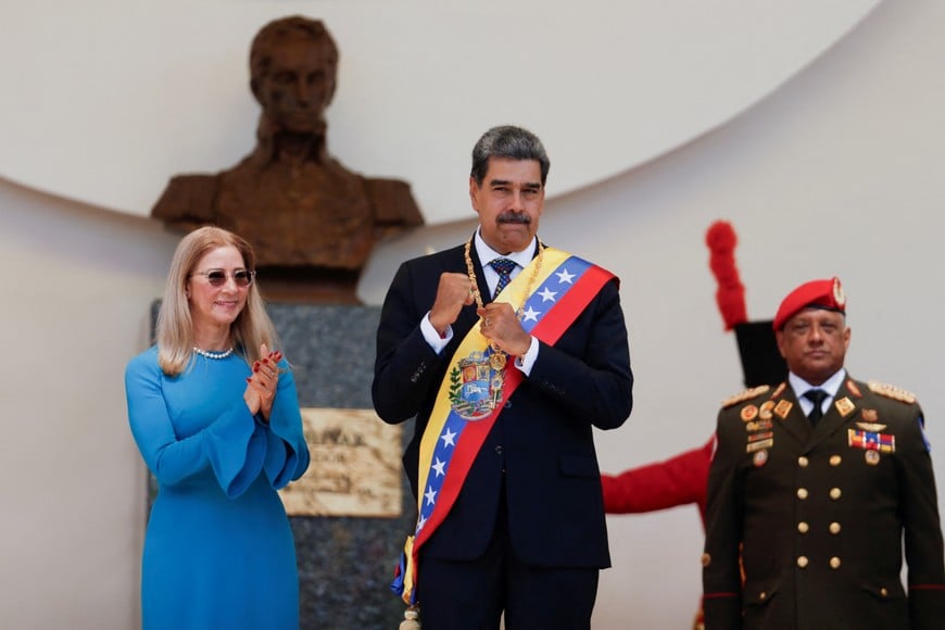 President Nicolas Maduro and his wife Cilia Flores react on the day of his inauguration for a third six-year term in Caracas, Venezuela January 10, 2025. REUTERS/Leonardo Fernandez Viloria