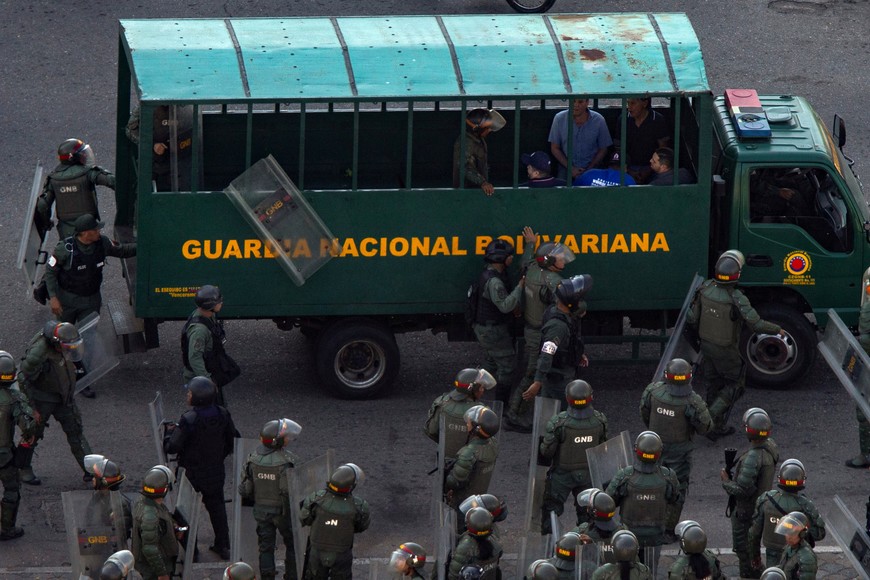 Venezuelan opposition supporters are seen in a police truck after being detained by security forces during a protest ahead of the Friday inauguration of President Nicolas Maduro for his third term, in Maracaibo, Venezuela January 9, 2025. REUTERS/Stringer