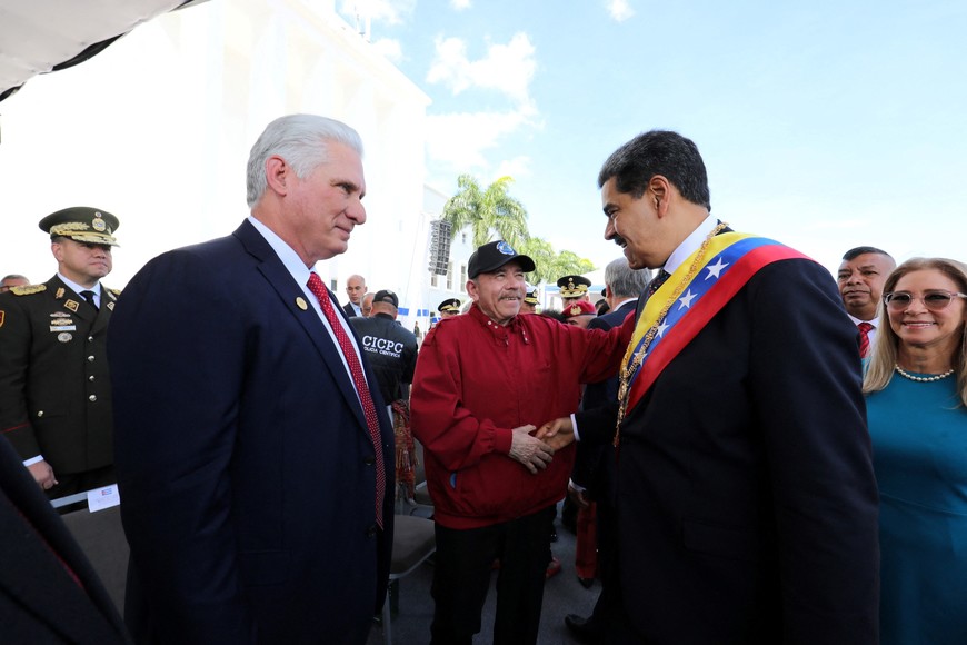 Venezuela's President Nicolas Maduro shakes hands with Nicaragua's President Daniel Ortega as Cuba's President Miguel Diaz-Canel looks on on the day of Maduro's inauguration for a third six-year term, in Caracas, Venezuela January 10, 2025. Zurimar Campos/Miraflores Palace/Handout via REUTERS ATTENTION EDITORS - THIS IMAGE HAS BEEN SUPPLIED BY A THIRD PARTY