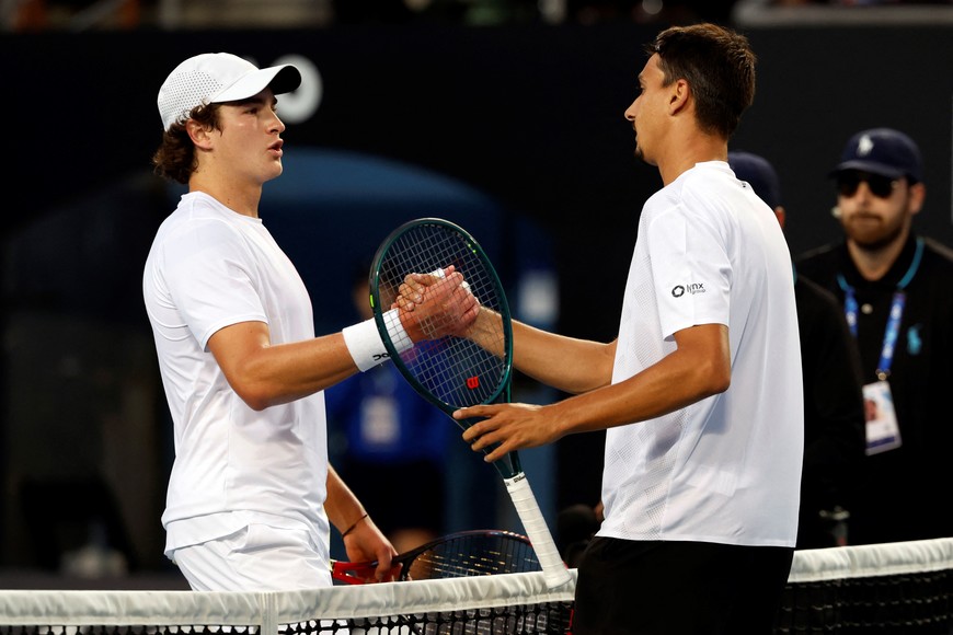 Tennis - Australian Open - Melbourne Park, Melbourne, Australia - January 16, 2025
Italy's Lorenzo Sonego shakes hands with Brazil's Joao Fonseca after winning his second round match REUTERS/Kim Kyung-Hoon