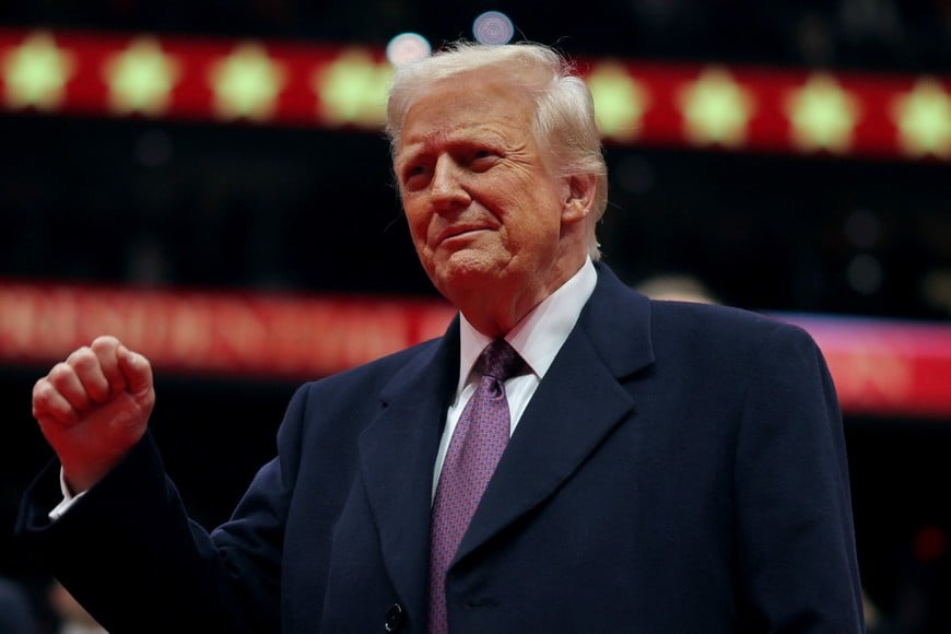 U.S. President Donald Trump gestures during the inaugural parade inside Capital One Arena on the inauguration day of his second presidential term, in Washington, U.S. January 20, 2025. REUTERS/Carlos Barria