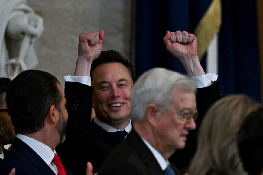 WASHINGTON, DC - JANUARY 20: Tesla CEO Elon Musk reacts as newly sworn-in President Donald Trump speaks during the 60th inaugural ceremony on January 20, 2025, in the US Capitol Rotunda in Washington, DC. Ricky Carioti/Pool via REUTERS     TPX IMAGES OF THE DAY