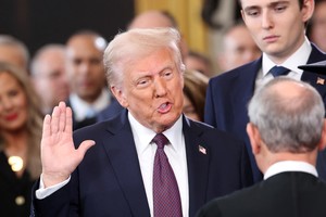 U.S. President Donald Trump takes oath on the day of his Presidential Inauguration at the Rotunda of the U.S. Capitol in Washington, U.S., January 20, 2025. REUTERS/Kevin Lamarque/Pool