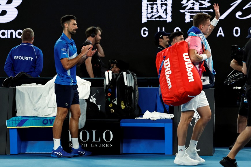 Tennis - Australian Open - Melbourne Park, Melbourne, Australia - January 19, 2025
Serbia's Novak Djokovic after winning his fourth round match as Czech Republic's Jiri Lehecka leaves the court REUTERS/Tingshu Wang